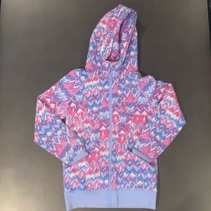 Iviva’s blue, pink, and white fleece jacket.